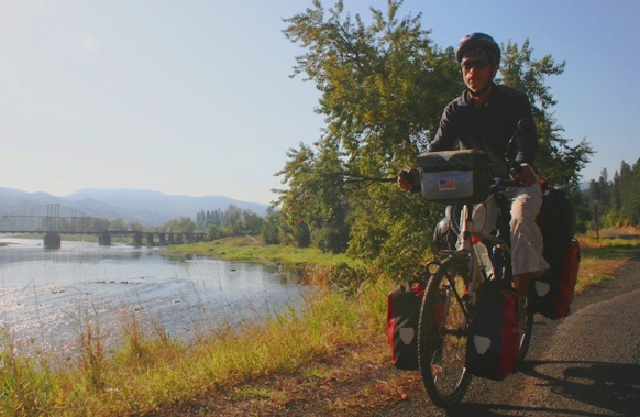 Eric cycling through a remote wilderness area in Idaho along the Locsha River.